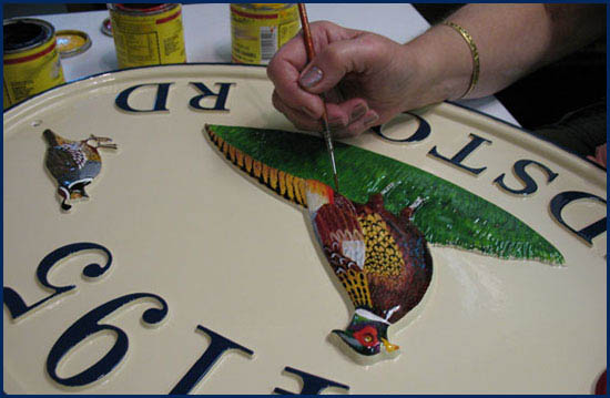 Hand painting a sign