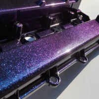 Valve cover coated in metallic powder