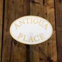 Custom white cast metal signs
