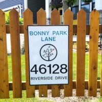 sign mounted on fence