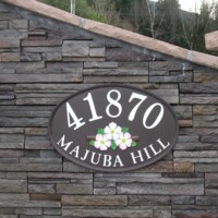 metal sign on stone wall