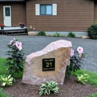 R12 metal sign on rock